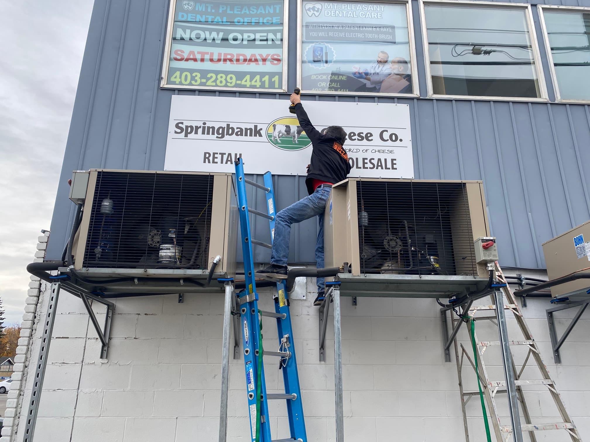 Sign installation on a building